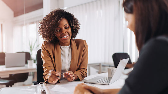 femail HR manager holding a meeting with a colleague