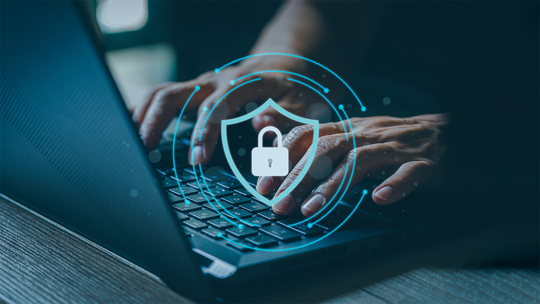 person typing on a keyboard with a padlock graphic