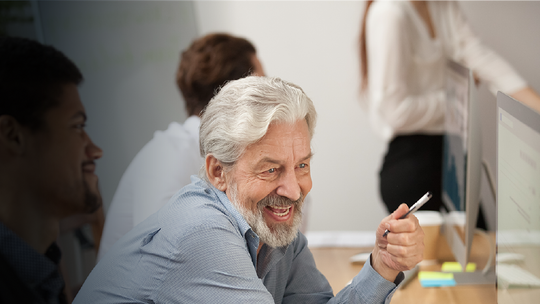 Man with beard on a video call with Colleage